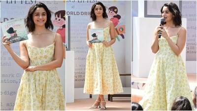 Today, Alia Bhatt released her first children's picture book. The actor also hosted a launch event for the same and attended in a summer-ready floral dress. The yellow ensemble features spaghetti straps, a plunging neckline, a flowy pleated skirt, and a midi hem length. She accessorised with sandals, gold rings, and dainty earrings. Side-parted open tresses, winged eyeliner, feathered brows, blush pink lip tint, and rouged cheeks completed the glam. (HT Photo/Varinder Chawla) Today, Alia Bhatt released her first children's picture book. The actor also hosted a launch event for the same and attended in a summer-ready floral dress. The yellow ensemble features spaghetti straps, a plunging neckline, a flowy pleated skirt, and a midi hem length. She accessorised with sandals, gold rings, and dainty earrings. Side-parted open tresses, winged eyeliner, feathered brows, blush pink lip tint, and rouged cheeks completed the glam. (HT Photo/Varinder Chawla)