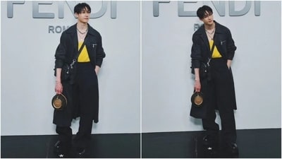 Stary Kids' Bang Chan attended the Fendi show during Milan Fashion Week in a stellar all-Fendi outfit. This is Chan's solo debut at any major fashion week event. He wore a yellow tank top, tailored blue pleated pants, and a grey trench coat. Black chunky boots, an over-the-body bag, a mini handbag, layered chains, and a messy hairdo rounded off the effortless styling. (Instagram) Stary Kids' Bang Chan attended the Fendi show during Milan Fashion Week in a stellar all-Fendi outfit. This is Chan's solo debut at any major fashion week event. He wore a yellow tank top, tailored blue pleated pants, and a grey trench coat. Black chunky boots, an over-the-body bag, a mini handbag, layered chains, and a messy hairdo rounded off the effortless styling. (Instagram)
