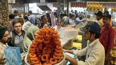 In Srinagar, people gathered in the markets to buy sweets and bakeries, on the eve of Eid Ul Adha. The festival will be celebrated in India on June 17. (PTI Photo) In Srinagar, people gathered in the markets to buy sweets and bakeries, on the eve of Eid Ul Adha. The festival will be celebrated in India on June 17. (PTI Photo)