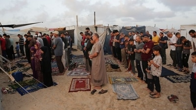 Palestinians offer their morning prayers for Eid ul Adha in makeshift camps at Khan Younis, Gaza. (AP Photo/Jehad Alshrafi) Palestinians offer their morning prayers for Eid ul Adha in makeshift camps at Khan Younis, Gaza. (AP Photo/Jehad Alshrafi)