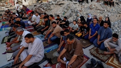 Amidst the Israel-Hamas conflict in Khan Yunis, Gaza, Muslims offer their morning prayers by the ruins of Al-Rahma mosque. (REUTERS/Mohammed Salem) Amidst the Israel-Hamas conflict in Khan Yunis, Gaza, Muslims offer their morning prayers by the ruins of Al-Rahma mosque. (REUTERS/Mohammed Salem)