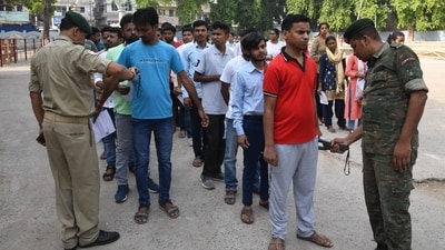 Security personnel had been deployed outside exam centers who thoroughly checked the candidates before they entered the exam halls ( Photo by Santosh Kumar) Security personnel had been deployed outside exam centers who thoroughly checked the candidates before they entered the exam halls ( Photo by Santosh Kumar)