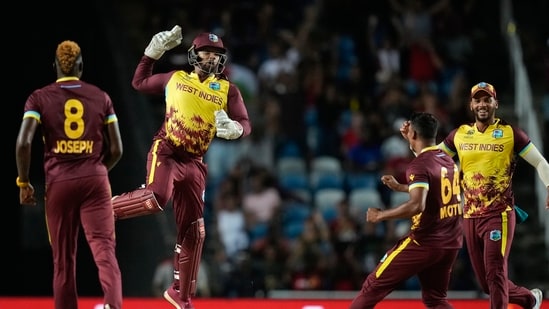 West Indies' Nicholas Pooran, second left, celebrates after taking a catch to dismiss New Zealand's captain Kane Williamson (PTI)
