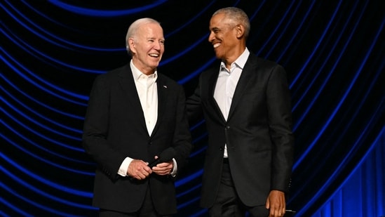 TOPSHOT - US President Joe Biden (L) stands with former US President Barack Obama onstage during a campaign fundraiser at the Peacock Theater in Los Angeles on June 15, 2024. (AFP)