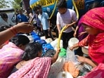 People collect water from a Delhi Jal Board tanker at Sanjay Colony in Okhla Industrial Area Phase-2 on Sunday. (Arvind Yadav/HT Photo) People collect water from a Delhi Jal Board tanker at Sanjay Colony in Okhla Industrial Area Phase-2 on Sunday. (Arvind Yadav/HT Photo)