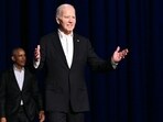 US President Joe Biden (R) gestures as he arrives onstage with former US President Barack Obama during a campaign fundraiser at the Peacock Theater in Los Angeles on June 15, 2024. (Photo by Mandel NGAN / AFP)