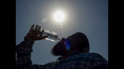 A man drinks water to quench his thirst on a hot summer day, in Amritsar, Monday. (PTI) A man drinks water to quench his thirst on a hot summer day, in Amritsar, Monday. (PTI)