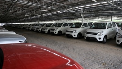 Cars are seen parked under solar panels at the manufacturing plant of Maruti Suzuki in Manesar, in the northern state of Haryana (Anushree Fadnavis/Reuters)