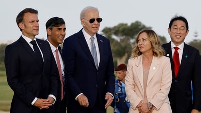 US President Joe Biden, zoned out, salutes Italy's Prime Minister Giorgia Meloni upon arrival for the G7 Summit hosted by Italy in Apulia region, on June 13, 2024 in Savelletri. (Photo by Ludovic MARIN / AFP) (AFP) US President Joe Biden, zoned out, salutes Italy's Prime Minister Giorgia Meloni upon arrival for the G7 Summit hosted by Italy in Apulia region, on June 13, 2024 in Savelletri. (Photo by Ludovic MARIN / AFP) (AFP)