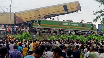 Onlookers watch as rescuers work after a cargo train rammed Kanchanjunga Express, a passenger train. (AP) Onlookers watch as rescuers work after a cargo train rammed Kanchanjunga Express, a passenger train. (AP)