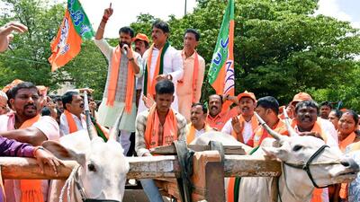 Karnataka BJP president B Y Vijayendra with party supporters stage a protest against the state government for a price hike on petrol and diesel, in Bengaluru on Monday. (ANI) Karnataka BJP president B Y Vijayendra with party supporters stage a protest against the state government for a price hike on petrol and diesel, in Bengaluru on Monday. (ANI)