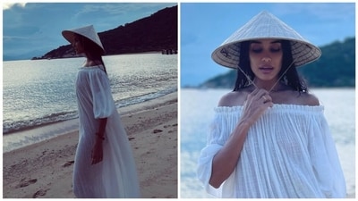Lisa Haydon also shared some solo photos from the beach taken during her family trip to Vietnam. She wore a white dress and sported Vietnam's famous conical hat in the photos. Lisa Haydon also shared some solo photos from the beach taken during her family trip to Vietnam. She wore a white dress and sported Vietnam's famous conical hat in the photos.