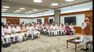 New Delhi, Jun 09 (ANI): Prime Minister-designate Narendra Modi addresses a meeting with National Democratic Alliance (NDA) leaders before the swearing-in ceremony of the new Cabinet and council of ministers, at his residence in New Delhi on Sunday. (ANI Photo) (ANI) New Delhi, Jun 09 (ANI): Prime Minister-designate Narendra Modi addresses a meeting with National Democratic Alliance (NDA) leaders before the swearing-in ceremony of the new Cabinet and council of ministers, at his residence in New Delhi on Sunday. (ANI Photo) (ANI)