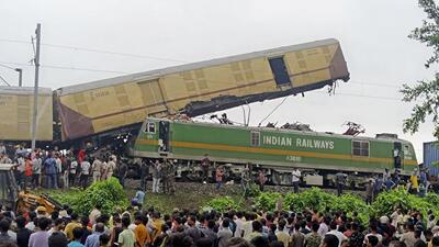 Onlookers watch as rescuers work after a cargo train rammed into Kanchanjunga Express, a passenger train, near New Jalpaiguri station in West Bengal (AP) Onlookers watch as rescuers work after a cargo train rammed into Kanchanjunga Express, a passenger train, near New Jalpaiguri station in West Bengal (AP)