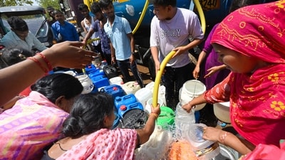 People collect water from a Delhi Jal Board tanker at Sanjay Colony in Okhla Industrial Area Phase-2 on Sunday. (Arvind Yadav/HT Photo) People collect water from a Delhi Jal Board tanker at Sanjay Colony in Okhla Industrial Area Phase-2 on Sunday. (Arvind Yadav/HT Photo)