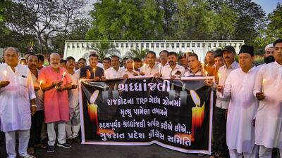 Rajkot: Congress workers hold a candlelight vigil to pay tribute to those killed in a fire at TRP Gaming Zone, in Rajkot (PTI FILE PHOTO) Rajkot: Congress workers hold a candlelight vigil to pay tribute to those killed in a fire at TRP Gaming Zone, in Rajkot (PTI FILE PHOTO)