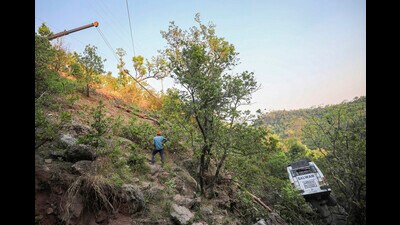 Reasi: A crane being used to pull out the bus which plunged into a gorge following a terrorist attack on pilgrims, in Reasi district of Jammu and Kashmir, Tuesday, June 11, 2024. At least 9 people were killed and 33 others suffered injuries in the terror attack on the bus, according to officials. (PTI Photo)(PTI06_11_2024_000304B) (PTI) Reasi: A crane being used to pull out the bus which plunged into a gorge following a terrorist attack on pilgrims, in Reasi district of Jammu and Kashmir, Tuesday, June 11, 2024. At least 9 people were killed and 33 others suffered injuries in the terror attack on the bus, according to officials. (PTI Photo)(PTI06_11_2024_000304B) (PTI)