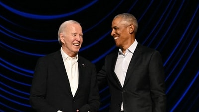 A confused Joe Biden was seen being led off the stage by Barack Obama at an LA event (Photo by Mandel NGAN / AFP) (AFP) A confused Joe Biden was seen being led off the stage by Barack Obama at an LA event (Photo by Mandel NGAN / AFP) (AFP)