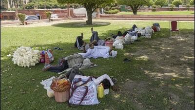 Vendors rest in the shade of a tree on a hot summer day in New Delhi on Sunday. (PTI Photo) Vendors rest in the shade of a tree on a hot summer day in New Delhi on Sunday. (PTI Photo)