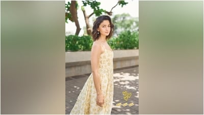 Alia styled the sundress with minimal accessories, including statement gold rings featuring heart and bow charms, sun-shaped drop earrings, and white sandals. Lastly, side-parted loose locks styled in soft waves completed Alia's hairdo with the ensemble. (Instagram) Alia styled the sundress with minimal accessories, including statement gold rings featuring heart and bow charms, sun-shaped drop earrings, and white sandals. Lastly, side-parted loose locks styled in soft waves completed Alia's hairdo with the ensemble. (Instagram)