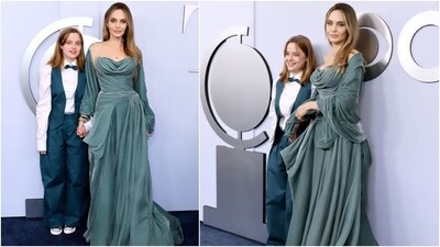Angeline Jolie attended the Tony Awards in a regal, teal velvet gown by Atelier Versace. The actor and producer brought her 15-year-old daughter Vivienne for the special night. Angelina's dress features a corseted waist, a pleated full skirt, a strapless plunging neckline, a matching shawl, and a floor-sweeping hem. She styled the ensemble with loose locks, minimal makeup, stacked bracelets, and ear cuffs. (Instagram) Angeline Jolie attended the Tony Awards in a regal, teal velvet gown by Atelier Versace. The actor and producer brought her 15-year-old daughter Vivienne for the special night. Angelina's dress features a corseted waist, a pleated full skirt, a strapless plunging neckline, a matching shawl, and a floor-sweeping hem. She styled the ensemble with loose locks, minimal makeup, stacked bracelets, and ear cuffs. (Instagram)