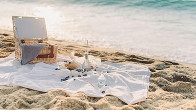 Sunset beach picnic: There are few places that can match the captivating charm of a beach at dusk. Fill a basket with delicacies such as fresh fruit, handmade cheeses and a chilled bottle of champagne. With the sound of the waves lulling you to sleep, spread out a comfortable blanket on the smooth beach and enjoy a romantic meal as the sun sets. (Pexels) Sunset beach picnic: There are few places that can match the captivating charm of a beach at dusk. Fill a basket with delicacies such as fresh fruit, handmade cheeses and a chilled bottle of champagne. With the sound of the waves lulling you to sleep, spread out a comfortable blanket on the smooth beach and enjoy a romantic meal as the sun sets. (Pexels)