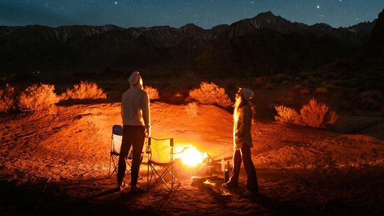 Enjoy a romantic picnic under the stars to really appreciate the magic of a starry sky. Choose a secluded spot where the stars are bright, away from city lights. Take a thermos of hot chocolate or mulled wine and a selection of gourmet treats such as charcuterie, olives and crusty bread to keep you warm as the evening wears on. Pack a telescope so you can look at the stars and keep an eye out for shooting stars so you can make wishes with them. (Pexels)