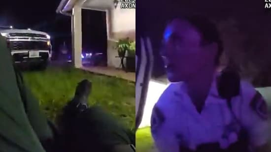 Deputies administer life-saving measures to the wounded officer Shane McCough as Hillsborough County Sheriff authorities investigate a homicide on Cactus Wren Place, Tampa, on June 16, 2024.