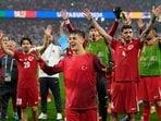 Turkey's Arda Guler, center, celebrates with team mates after a Group F match between Turkey and Georgia at the Euro 2024 soccer tournament in Dortmund, Germany, Tuesday, June 18