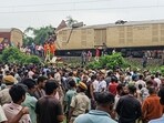 People look on at the site of a collision between an express passenger train and a goods train in Nirmaljote, near Rangapani station in India's West Bangal state on June 17, 2024. (AFP) People look on at the site of a collision between an express passenger train and a goods train in Nirmaljote, near Rangapani station in India's West Bangal state on June 17, 2024. (AFP)
