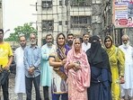 Mumbai, India. June 17, 2024: Residents of Kailash Parbat Society outside the building. Five hundred residents of Kailash Parbat CHS, located next to the BKC junction, are set to be rendered homeless. BMC officials will arrive with police protection on June 19 to conduct the court-ordered demolition of the C1 category building in Mumbai, India. June 17, 2024. (Photo by Raju Shinde/HT Photo) Mumbai, India. June 17, 2024: Residents of Kailash Parbat Society outside the building. Five hundred residents of Kailash Parbat CHS, located next to the BKC junction, are set to be rendered homeless. BMC officials will arrive with police protection on June 19 to conduct the court-ordered demolition of the C1 category building in Mumbai, India. June 17, 2024. (Photo by Raju Shinde/HT Photo)