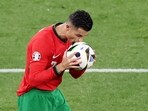 Portugal's Cristiano Ronaldo kisses the ball during the match
