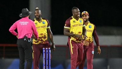 Rovman West Indies' captain Rovman Powell (C) celebrates dismissing Afghanistan's captain Rashid Khan (AFP) Rovman West Indies' captain Rovman Powell (C) celebrates dismissing Afghanistan's captain Rashid Khan (AFP)