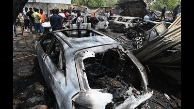 Cars gutted in fire at a garage in Chinhat area of Lucknow on Tuesday. (Deepak Gupta/ht)