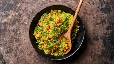 This image released by Milk Street shows a recipe for curried chicken fried rice. (Milk Street via AP) This image released by Milk Street shows a recipe for curried chicken fried rice. (Milk Street via AP)