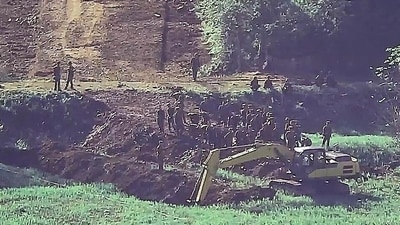 In this undated photo provided on Tuesday, June 18, 2024, by South Korea Defense Ministry, North Korean soldiers work at an undisclosed location near the border area, as seen from a South Korean guard area. South Korean soldiers fired warning shots to repel North Korean soldiers who temporarily crossed the rivals' land border Tuesday for the second time this month, South Korea's military said. (AP) In this undated photo provided on Tuesday, June 18, 2024, by South Korea Defense Ministry, North Korean soldiers work at an undisclosed location near the border area, as seen from a South Korean guard area. South Korean soldiers fired warning shots to repel North Korean soldiers who temporarily crossed the rivals' land border Tuesday for the second time this month, South Korea's military said. (AP)
