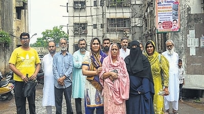 Mumbai, India. June 17, 2024: Residents of Kailash Parbat Society outside the building. Five hundred residents of Kailash Parbat CHS, located next to the BKC junction, are set to be rendered homeless. BMC officials will arrive with police protection on June 19 to conduct the court-ordered demolition of the C1 category building in Mumbai, India. June 17, 2024. (Photo by Raju Shinde/HT Photo) Mumbai, India. June 17, 2024: Residents of Kailash Parbat Society outside the building. Five hundred residents of Kailash Parbat CHS, located next to the BKC junction, are set to be rendered homeless. BMC officials will arrive with police protection on June 19 to conduct the court-ordered demolition of the C1 category building in Mumbai, India. June 17, 2024. (Photo by Raju Shinde/HT Photo)