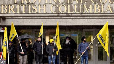 Sikh protesters stand outside of Surrey Provincial Court, where four suspects arrested by Canadian police for the murder of Sikh separatist leader Hardeep Singh Nijjar, appear, in Surrey, British Columbia, Canada, on May 21. (REUTERS) Sikh protesters stand outside of Surrey Provincial Court, where four suspects arrested by Canadian police for the murder of Sikh separatist leader Hardeep Singh Nijjar, appear, in Surrey, British Columbia, Canada, on May 21. (REUTERS)