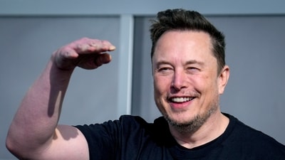 Tesla CEO Elon Musk waves as he leaves the Tesla Gigafactory for electric cars in Gruenheide near Berlin, Germany. (AP)