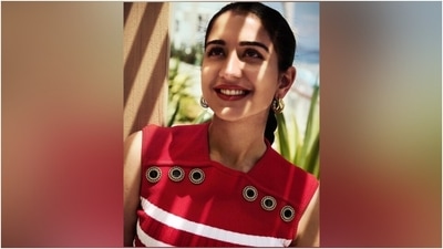 Radhika's dark blue pants feature metal buttons embellished on the waist, faux pockets, a high-rise waist, and a straight-leg fitting. To accessorise the ensemble, she chose tan leather loafers adorned with a Prada logo embellishment, rings, bracelets adorned with charms, a gold watch, sunglasses, and triple hoop earrings. (Instagram) Radhika's dark blue pants feature metal buttons embellished on the waist, faux pockets, a high-rise waist, and a straight-leg fitting. To accessorise the ensemble, she chose tan leather loafers adorned with a Prada logo embellishment, rings, bracelets adorned with charms, a gold watch, sunglasses, and triple hoop earrings. (Instagram)