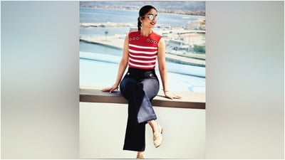 Radhika Merchant made a strong case for nautical fashion with these new pictures. The post shows her wearing a red and white stripe-printed blouse and dark blue pants. According to Shaleena Nathani's post, the top is from Balmain, the pants are by Sando Paris, and the shoes are from Prada. (Instagram) Radhika Merchant made a strong case for nautical fashion with these new pictures. The post shows her wearing a red and white stripe-printed blouse and dark blue pants. According to Shaleena Nathani's post, the top is from Balmain, the pants are by Sando Paris, and the shoes are from Prada. (Instagram)