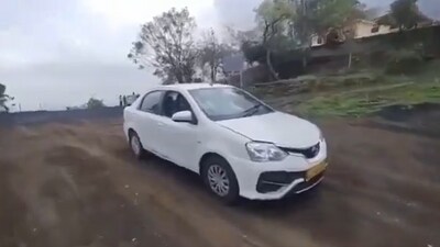 The woman was driving this car before she fell into the valley. (X/@Vijay Kumbhar) The woman was driving this car before she fell into the valley. (X/@Vijay Kumbhar)
