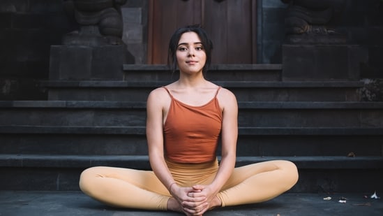 The Butterfly pose is a seated pose that helps in stimulating the pelvic region, alleviating menstrual discomfort. (Shutterstock)