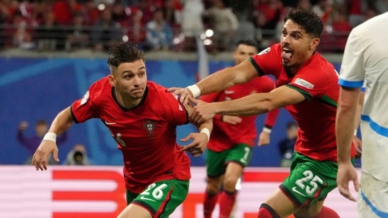 Portugal's Francisco Conceicao, left, celebrates his side's second goal during a Group F match between Portugal and Czech Republic (AP)