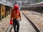 A man covers his face using a cloth to shield himself from the sun as he inspects railway tracks during a hot summer day in New Delhi. (REUTERS) A man covers his face using a cloth to shield himself from the sun as he inspects railway tracks during a hot summer day in New Delhi. (REUTERS)