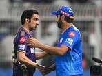 Mumbai Indians' Rohit Sharma (R) greets Kolkata Knight Riders' mentor Gautam Gambhir