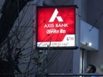 A man enters a branch of Axis Bank in New Delhi, India.