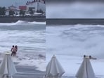 Russia: Man trying to save his girlfriend before she was washed away by massive waves in Sochi. 