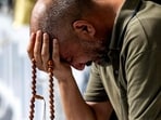 A man prays as he and other Muslim pilgrims perform the farewell circumambulation or "tawaf". (AFP)