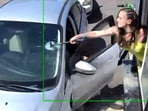 Emma Lee, 23, the owner of a Seattle espresso shop, smashed a customer's windshield with a hammer after he threw coffee at her Emma Lee, 23, the owner of a Seattle espresso shop, smashed a customer's windshield with a hammer after he threw coffee at her